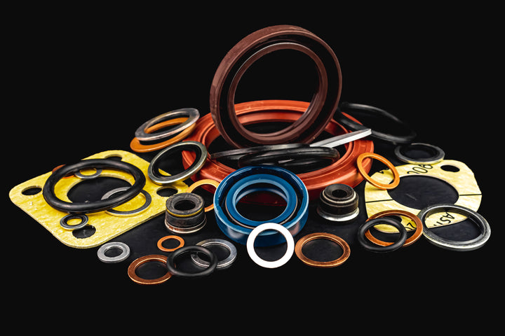 seals and gaskets, Oil seal, Copper washers, seal for valve stem oil, Black hydraulic and pneumatic o-ring, isolated on black background